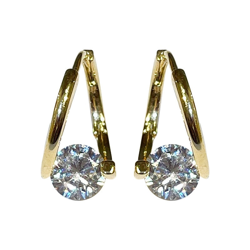 Boucle d'oreille Anneau Doré Point de Lumière / Le Bijou de la Femme Moderne et Élégante